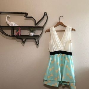 Low cut teal and cream bow pattern boutique dress